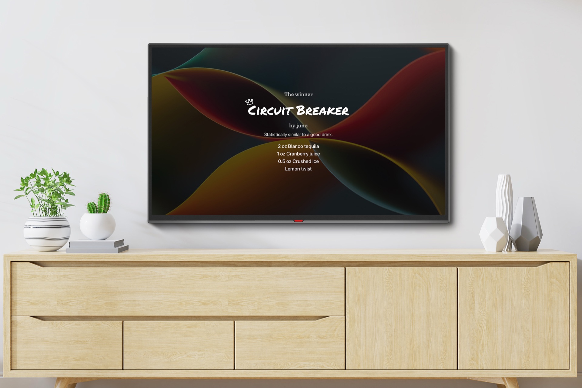 A wall-mounted TV showing the MixKings winner screen: a drink called Circuit Breaker with its recipe listed below